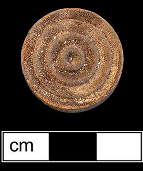 Checker game piece made of wood (front and back), 7/8” diameter - from 18BC27, Feature 34.